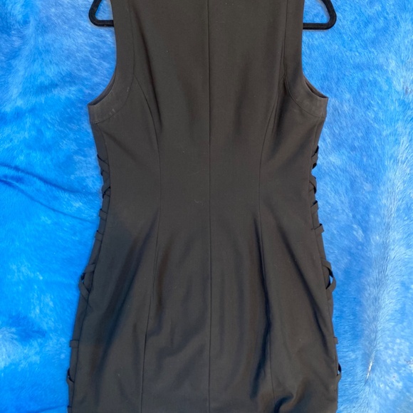 Black minidress with intricate bands of fabric on the front of the dress. - Picture 2 of 3